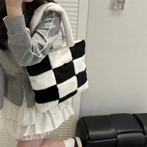 Classic black and white checkered plush tote bag with a soft faux fur texture and large capacity