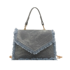 Chic blue denim square shoulder bag with distressed fringe edges and golden chain strap