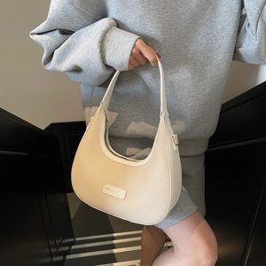 Miss Masi half-moon underarm bag in beige leather and woven raffia patchwork style