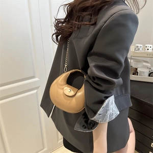 Minimalist camel leather crescent shoulder bag with gold hardware and chain strap