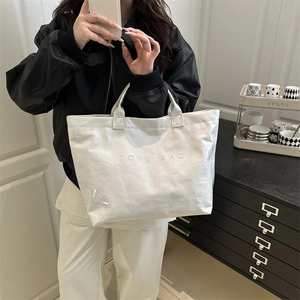 White Tyvek tote bag with wrinkled texture and TOTE BAG print for daily commute