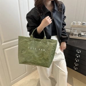 Fashionable grass green DuPont paper tote bag with TOTE BAG print for daily use