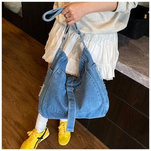 Japanese retro large capacity blue denim tote bag shown worn as a crossbody by a model