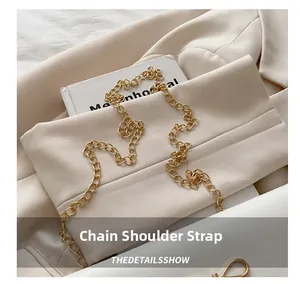Detail of elegant gold metal chain shoulder strap with high-gloss finish for handbags