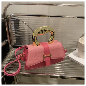 Pink textured fabric handbag with gold metal ring handle and H-shaped buckle detail