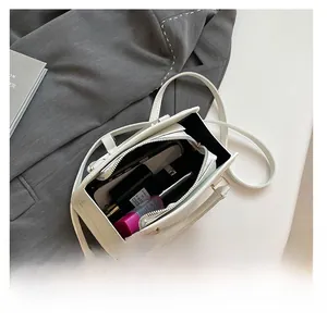 Top view of white Boston bag interior showing spacious storage for daily essentials