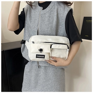 White nylon fanny pack with black zippers and transparent window pocket on a model