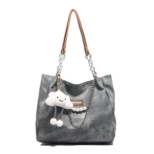 Large dark grey minimalist tote bag with chain strap and cute cloud charm accessory