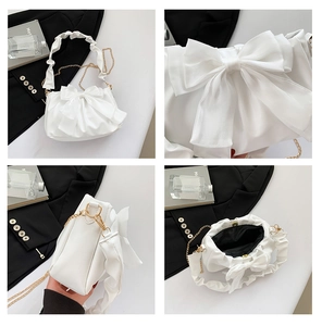 Detailed views of white bow shoulder bag with pleated handle and gold chain strap