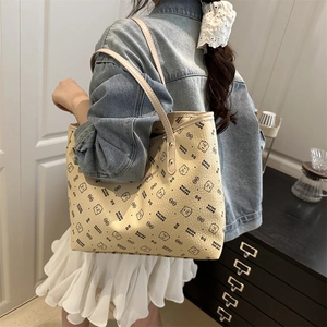 Large beige tote bag with bear pattern and leather texture for casual daily use