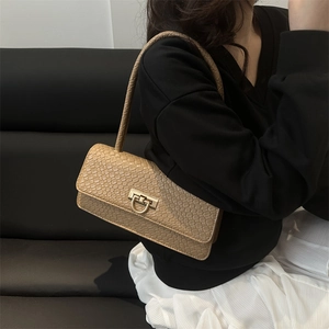 Women's chic beige embossed leather underarm bag with a golden D-shaped buckle
