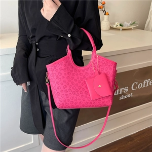 Hot pink embossed tote bag set with floral patterns and matching small pouch charm