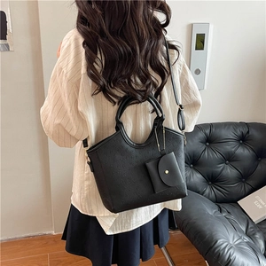 Classic black floral embossed tote bag with adjustable strap and matching coin purse