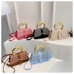 Collection of textured patchwork handbags with unique liquid metal gold handles in five colors