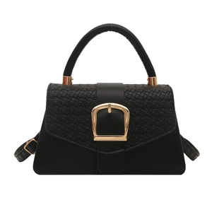 Classic black trapezoid handbag with woven flap texture and gold horseshoe buckle