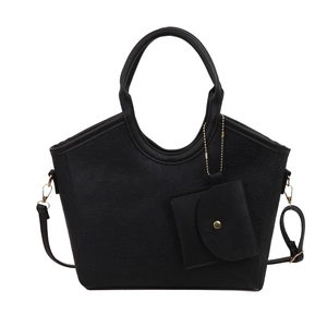 Black tote bag with 3D clover embossing and matching mini pouch on white background