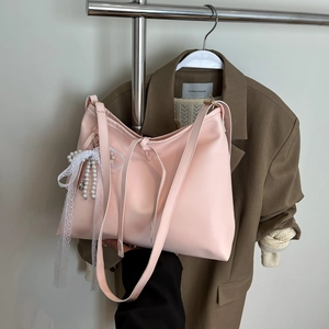 Pink faux leather tote bag with white lace bow and pearl charm for casual fashion