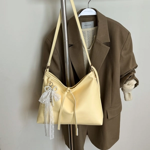Minimalist light yellow PU leather hobo shoulder bag with a lace pearl bow pendant