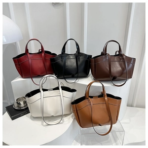 Detailed collection of minimalist leather tote bags in five elegant colors on display