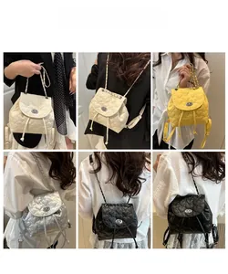 Detailed grid showing quilted heart-pattern mini backpacks with chain straps in four colors