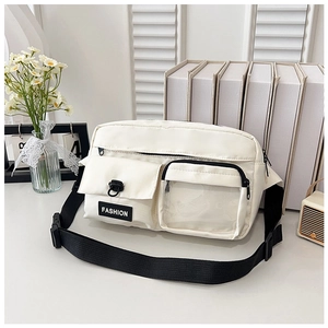 Detail of off-white crossbody bag featuring a transparent PVC pocket and buckle closures