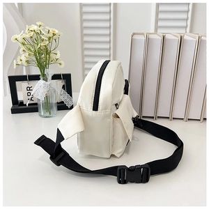 Detail of off-white minimalist crossbody bag with black adjustable strap and plastic buckle