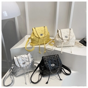 Detailed view of mini backpacks in four colors featuring heart-shaped quilting and chain drawstring