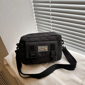 Black Japanese style nylon messenger bag with rabbit patch and adjustable strap