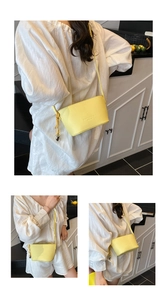 Detail of yellow lychee texture bucket bag with adjustable shoulder strap for women
