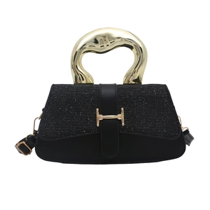 Chic black tote bag with unique liquid-gold metal handle and stylish H-shaped gold buckle