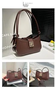 Detail view of coffee leather shoulder bag with elegant gold geometric metal buckle