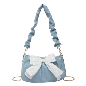 Light blue pleated shoulder bag with oversized white bow and gold chain strap