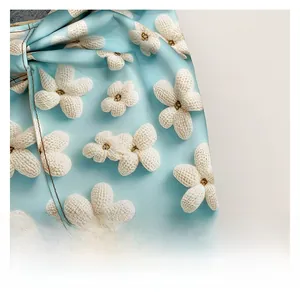 Macro shot of light blue fabric with white floral patterns for women's tote bags