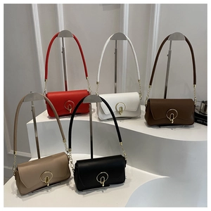 Group shot of colorful leather shoulder bags with gold round buckles and chain straps