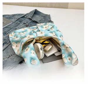 Detailed interior view of floral tote bag showing large capacity for daily essentials