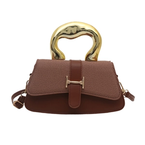 Brown panelled handbag with textured fabric, leather trim and unique gold metal handles