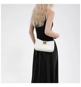 Detailed back view of minimalist white leather shoulder bag with gold square buckle