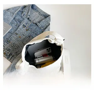 Large capacity white corduroy tote bag interior with tablet and everyday essentials