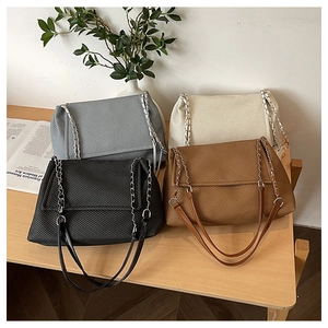 Detailed collection of textured tote bags in four colors with metal chain straps