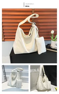 Detail of white corduroy tote bag with matching mini pouch and leather brand label