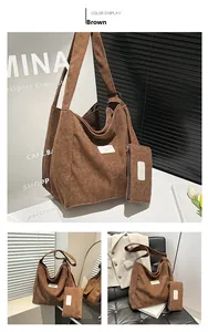 Detail of brown corduroy tote bag and matching pouch set with brand leather label