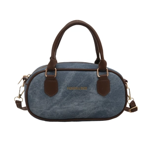 Denim bowling handbag with brown leather trim and golden hardware for women