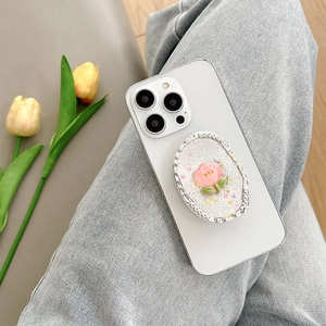 Macro detail of tulip griptok with silver wavy edges and pink flower on a white phone