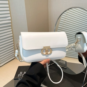 Minimalist white leather crossbody bag with elegant gold interlocking buckle and strap