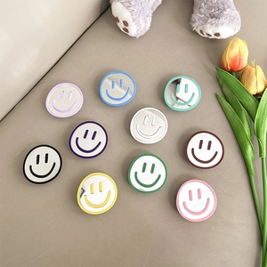 Smiley face mirror phone grip sockets in 10 pastel colors for makeup and desk stand use