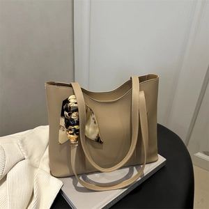 Elegant khaki tote bag with fashion scarf handle and spacious minimalist leather design