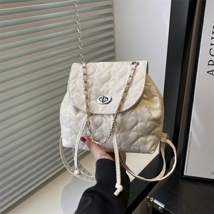 Chic cream white mini quilted backpack with heart patterns and silver chain straps