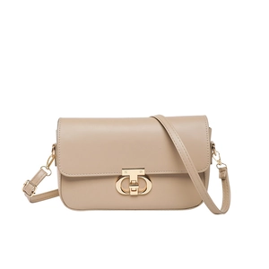 Minimalist beige leather shoulder bag with vintage metal lock and adjustable strap