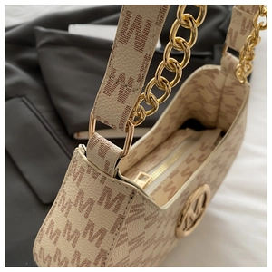 Detail of beige underarm bag with M-letter monogram print and gold chain strap