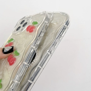 Detail of iPhone case featuring 3D cherry decor, wavy edges and pearl texture finish